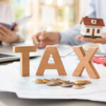 Estate planning documents and calculator representing taxation of estates in Florida