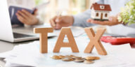 Estate planning documents and calculator representing taxation of estates in Florida